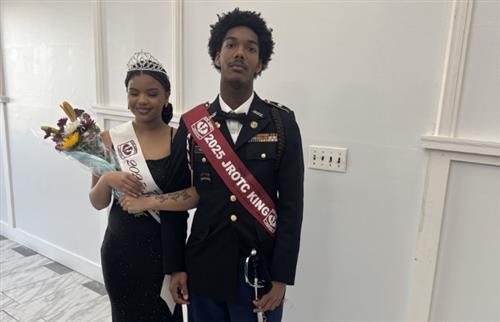 Male and Female students queen and king posing